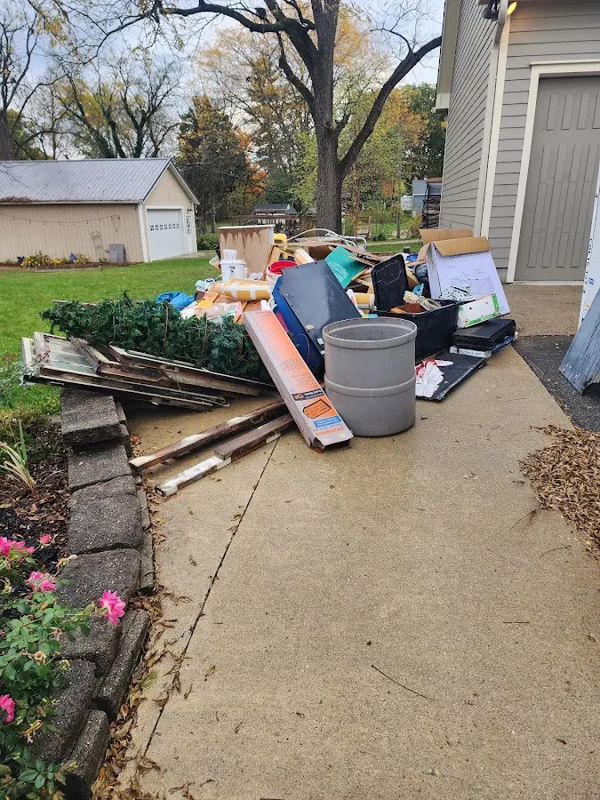 Dumpster being loaded with debris for Residential Dumpster Rental in Donna